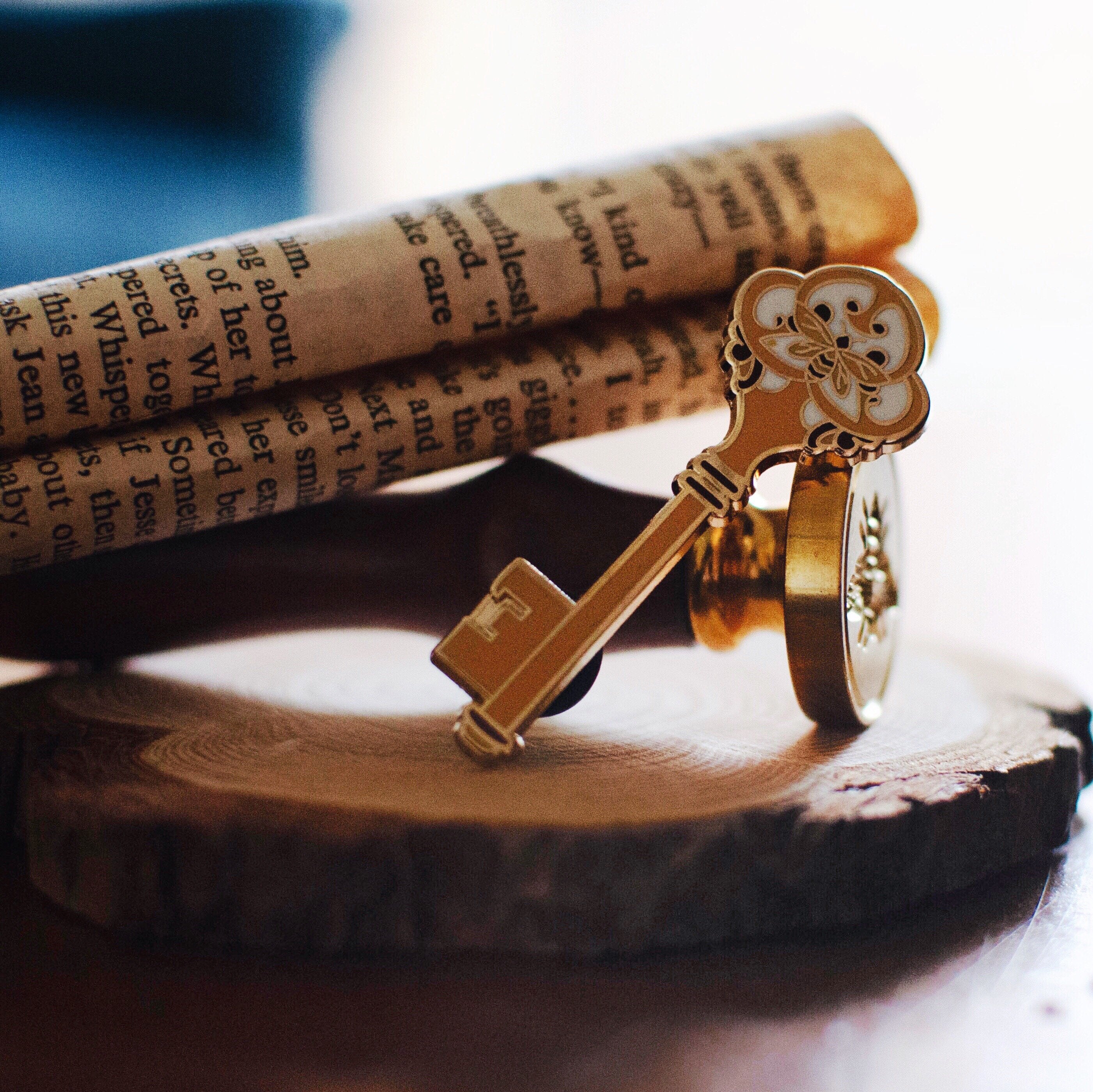 Image of Gold Key enamel pin with bee design