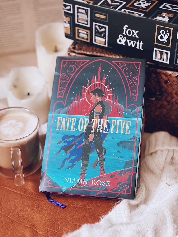 Book titled 'Fate of the Five' by Niamh Rose with a fox & wit box in the background.