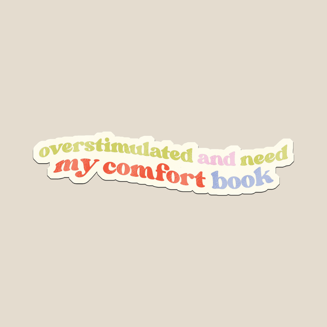 This Overstimulated and Need My Comfort Book sticker and  features soft pastel rainbow text with a retro vibe